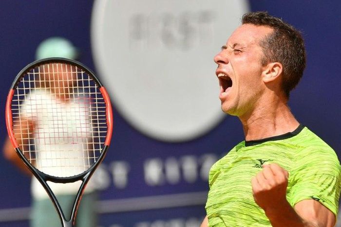 Germany's Philipp Kohlschreiber celebrates beating Portugal's Joao Sousa in Kitzbuhel, Austria, to secure his eighth ATP title