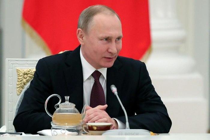 Russian President Vladimir Putin attends a meeting with Northern Fleet officers who took part in the combat activities in the Mediterranean off the coast of Syria at the Kremlin in Moscow on February 23, 2017
