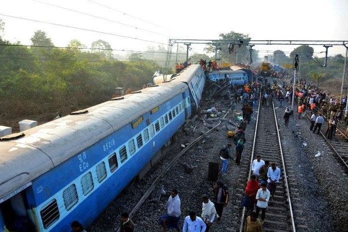 Rescue workers search for victims at the site of the derailment of the Jagdalpur-Bhubaneswar express train near Kuneru station in Andhra Pradesh state, southern India on January 22, 2017