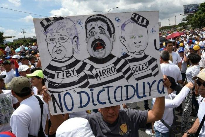 People protest against the government of Venezuelan President Nicolas Maduro, in Caracas on October 26, 2016