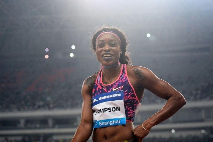 Jamaica's Elaine Thompson celebrates after winning the women’s 100 meters during the Shanghai Diamond League athletics competition in Shanghai on May 13, 2017