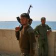 Fighters of the US-backed Syrian Democratic Forces guard a section of Tabqa Dam under their control on March 28, 2017