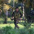 A soldiers runs after retrieving the rifle of a colleague after clashes with militants on Bohol island