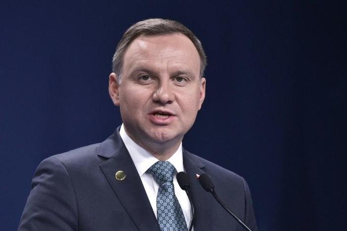 Poland's President Andrzej Duda signed into law a 2017 budget disputed as illegal by opposition MPs in parliament on January 13, 2017
