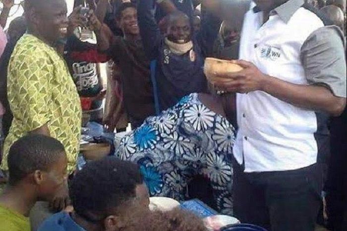 Ayo Fayose sampling his palmwine