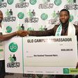 Winner of the Mr. Glo Campus Data Dude, Ogbuefi Pascal (right) being presented with a cheque by Globacom’s Head of Operations, South South, Mr. Nwachukwu Aja after winning the coveted prize during the Glo Campus Storm music concert at the Enugu Campus ...