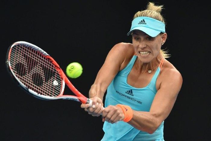 Germany's Angelique Kerber hits a return against Ukraine's Lesia Tsurenko during their women's singles match at the Australian Open in Melbourne on January 16, 2017