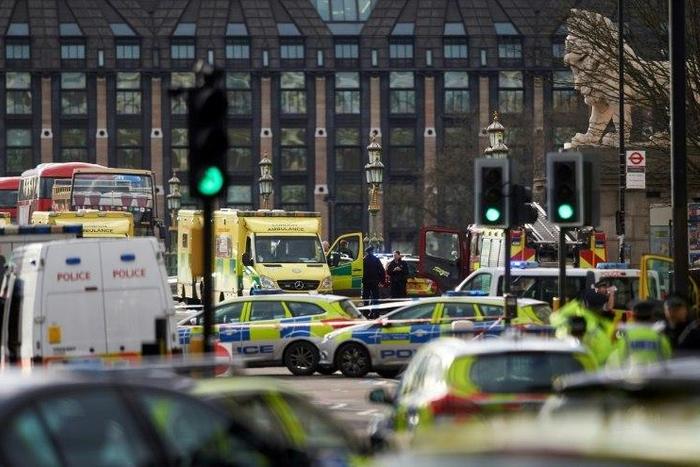 Members of the emergency services work on Westminster Bridge, alongside the Houses of Parliament in central London on March 22, 2017 during an emergency incident