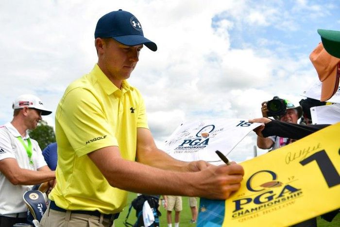 Jordan Spieth of the US signs autographs for fans during a practice round prior to the 2017 PGA Championship, at Quail Hollow Club in Charlotte, North Carolina, on August 8