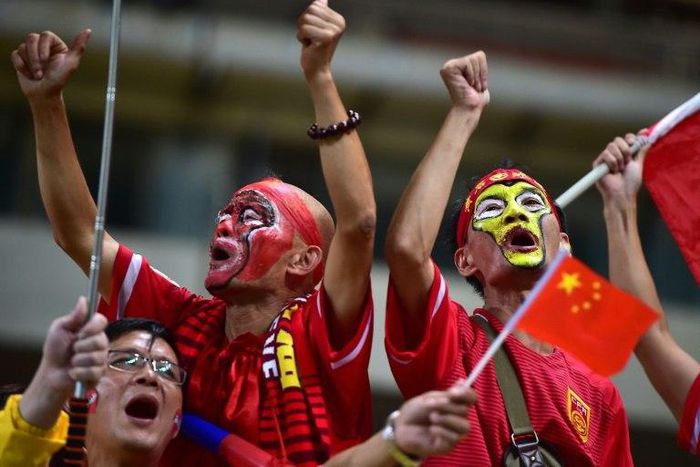 Chinese fans cheer during the 2018 World Cup qualifier against South Korea in Seoul on September 1, 2016
