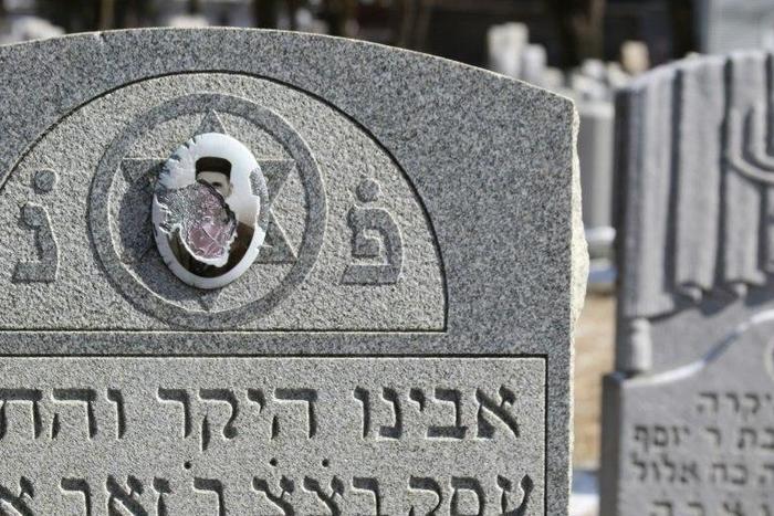 Vandalized stones are scattered at Stone Road or Waad Hakolel Cemetery in Rochester, New York on March 3, 2017