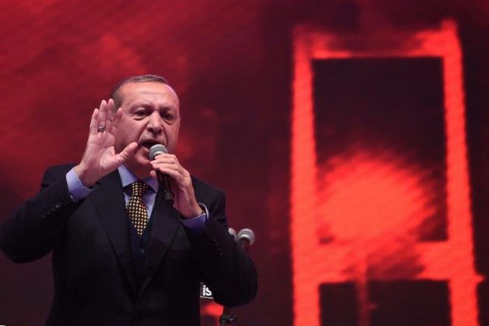 Turkish President Recep Tayyip Erdogan gives a speech on April 12, 2017 in Istanbul, pushing for a "yes" vote in the upcoming referendum on whether to change the current parliamentary system into an executive presidency