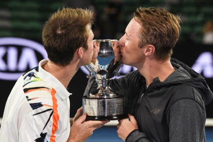 Australia's John Peers (L) and Finland's Henri Kontinen celebrate winning the men's doubles final of the Australian Open on January 28, 2017