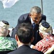 US President Barack Obama (R) and Japanese Prime Minister Shinzo Abe greet veterans at Kilo Pier overlooking the USS Arizona Memorial at Pearl Harbor in Honolulu, Hawaii on December 27, 2016