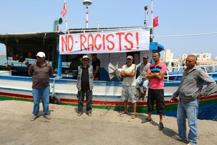 Tunisian fishermen gather on August 6, 2017 in the port of Zarzis in southeastern Tunisia to protest against a possible berthing of the C-Star vessel
