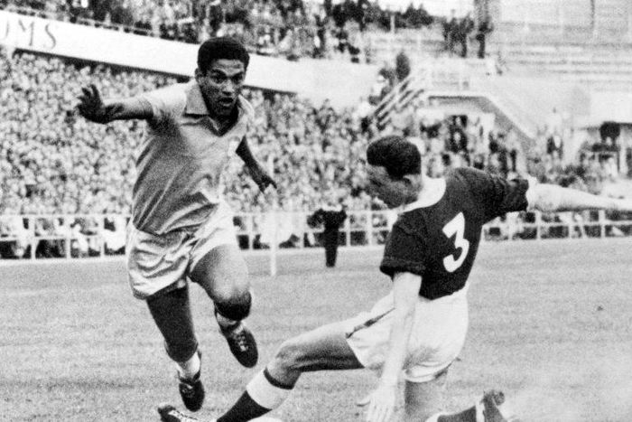 Brazilian soccer legend Mane Garrincha vies for the ball with Wales' Mel Hopkins in the World Cup quarter finals in June 1958