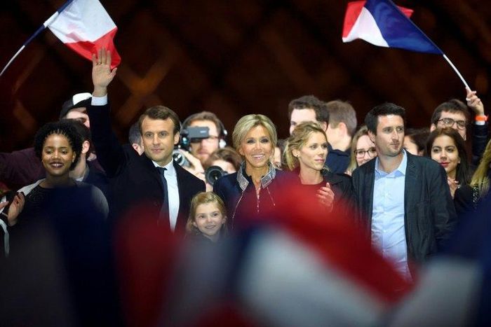 Emmanuel Macron with his wife Brigitte and members of her family at a victory party after his resounding win over far-right rival Marine Le Pen