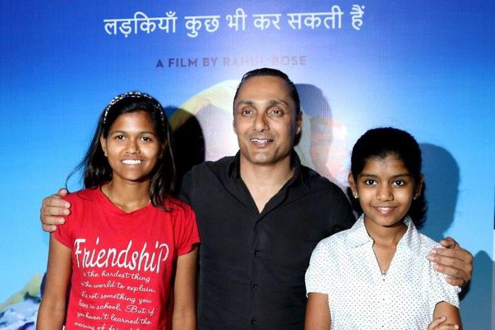 Indian mountaineer Poorna Malavath (L) and actress Aditi Inamdar (R) attend the screening of upcoming Hindi film ‘Poorna’ directed by Rahul Bose (C) in Mumbai on March 27, 2017