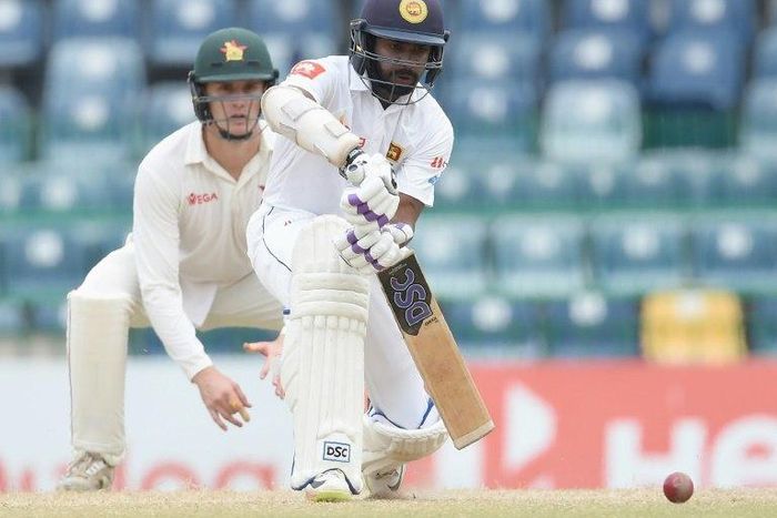 Sri Lankan batsman Niroshan Dickwella plays a shot during the final day of a one-off Test match between Sri Lanka and Zimbabwe at the R Premadasa Stadium in Colombo on July 18, 2017