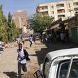 Sudanese protesters run away from tear gas smokes during a demonstration in Khartoum, on December 31, 2018