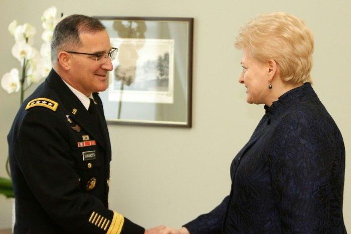 Lithuania's President Dalia Grybauskaite (R) shakes hand with Curtis Michael Scaparrotti, a four-star general in the US Army and Supreme Allied Commander Europe of NATO Allied Command Operations, during an official meeting in Vilnius on March 16, 2017