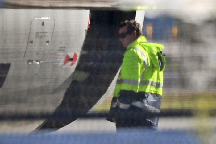 A man inspects the damaged engine cowling of a China Eastern Airbus A330 at Sydney Airport on June 12, 2017