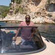 Don Jazzy driving a private boat on the French Rivera