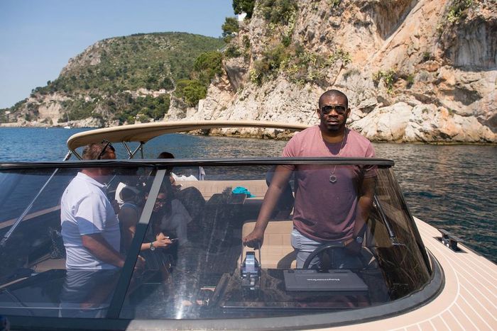 Don Jazzy driving a private boat on the French Rivera