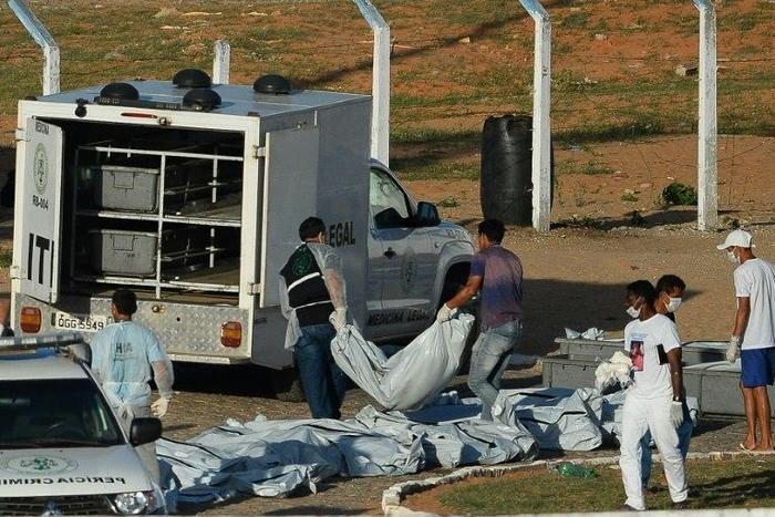 Corpses are removed from the Alcacuz Penitentiary after a fight between rival gangs left at least 26 prisoners dead, near Natal, in Brazil's state of Rio Grande do Norte, on January 15, 2017