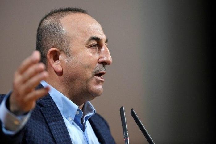 Turkish Foreign Minister Mevlut Cavusoglu threatens to unilaterally scrap migrant deal with the EU amid escalating diplomatic crisis