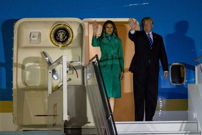 US President Donald Trump (R) and US First Lady Melania Trump (L) step off Air Force One upon their arrival at Chopin Airport in Warsaw, on July 5, 2017