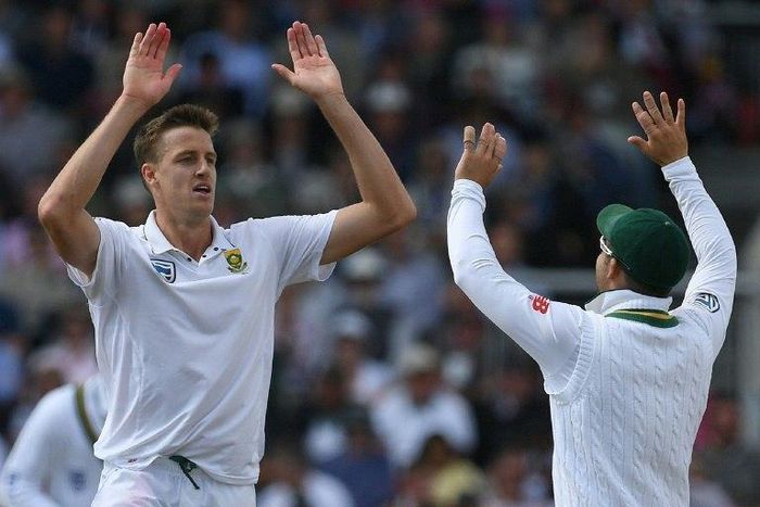 South Africa's Morne Morkel (left) celebrates taking the wicket of England's Dawid Malan on the first day of the fourth Test at Old Trafford on August 4, 2017