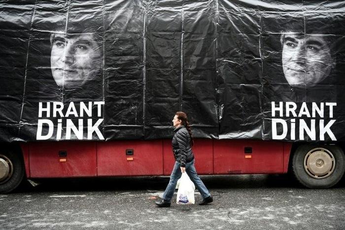 A banner shows late Turkish-Armenian journalist Hrant Dink in front of the offices of Armenian weekly newspaper "Agos" at a rally to commemorate the ten-year anniversary of his assassination, in Istanbul, on January 19, 2017