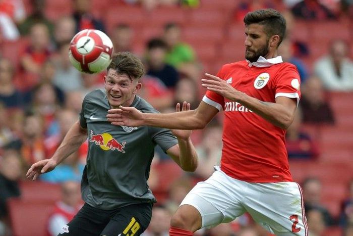 Leipzig's Scottish midfielder Oliver Burke (left) vies with Benfica's Argentinian defender Lisandro Lopez during their pre-season friendly match at The Emirates Stadium in north London on July 30, 2017