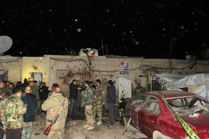 Syrian soldiers gather at the site of an attack in Kafr Sousa, southwest of the Syrian capital Damascus on January 12, 2017
