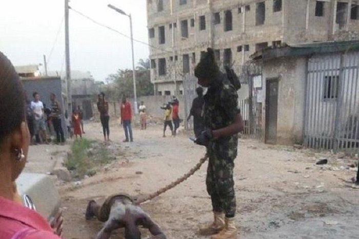 The soldier dealing with the bloody civilian