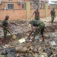 Soldiers defy early morning rain to clean-up Mushin