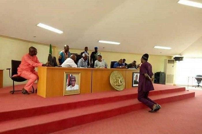 Hon. James Gbande kneeling before Governor Samuel Ortom