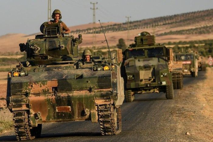 Turkish soldiers drive back to Turkey from the Syrian-Turkish border town of Jarabulus in September 2016