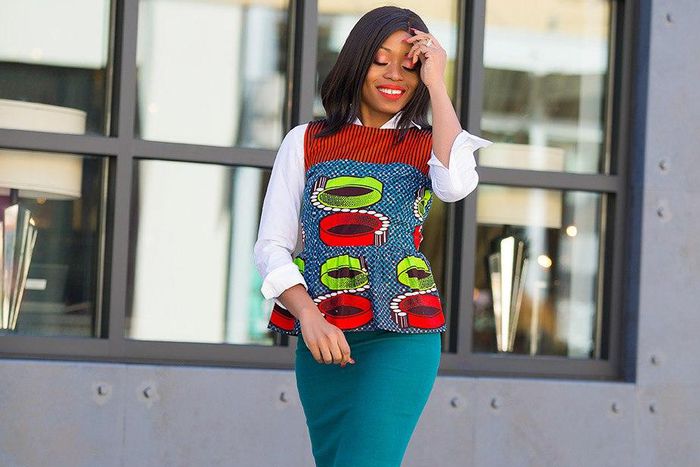 Stella Uzo chose a sleeveless print peplum over white shirt for a refreshing vibrant look