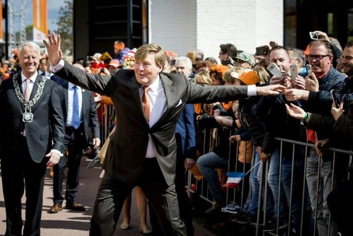 Dutch King Willem-Alexander gestures as he celebrates his 50th birthday on the traditional King's Day (Koningsdag) in the southern city of Tilburg