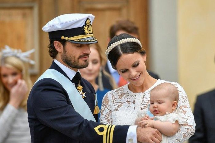 Sweden's Prince Carl Philip (L) and Princess Sofia at the christening of their first child Prince Alexander in September last year