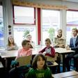 Dutch Queen Maxima and Dutch state secretary of education Sander Dekker sit in on a lesson at an elementary school--Dekker refused to grant an Islamic school funding after a member of the board voiced support for the Islamic State