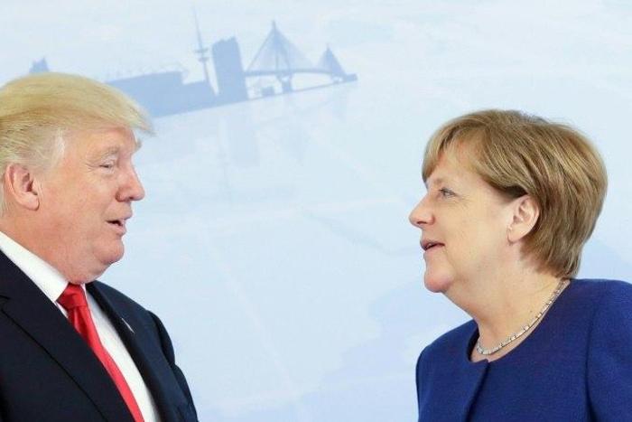 German Chancellor Angela Merkel (R) and US President Donald Trump pose for a photo prior to a bilateral meeting on the eve of the G20 summit in Hamburg, northern Germany, on July 6, 2017