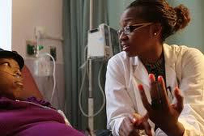 A nurse attending to a sickle cell patient.