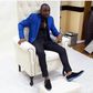 Davido sports blue cobalt blue blazer over noir shirt and pants