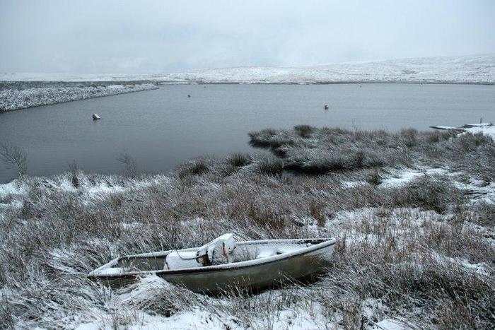 A derelict boat lies covered in snow next to Redbrook reservoir near the village of Marsden in northern England, on January 12, 2017