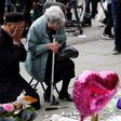 Two grieving people in Manchester