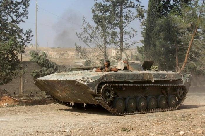Fighters from Fateh al-Sham Front take positions south of Aleppo in August 2016 during an offensive to break the government siege of the city