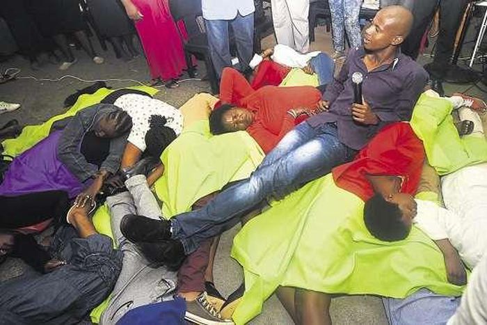 Pastor Penuel Mnguni sits on church members, tired from masturbating